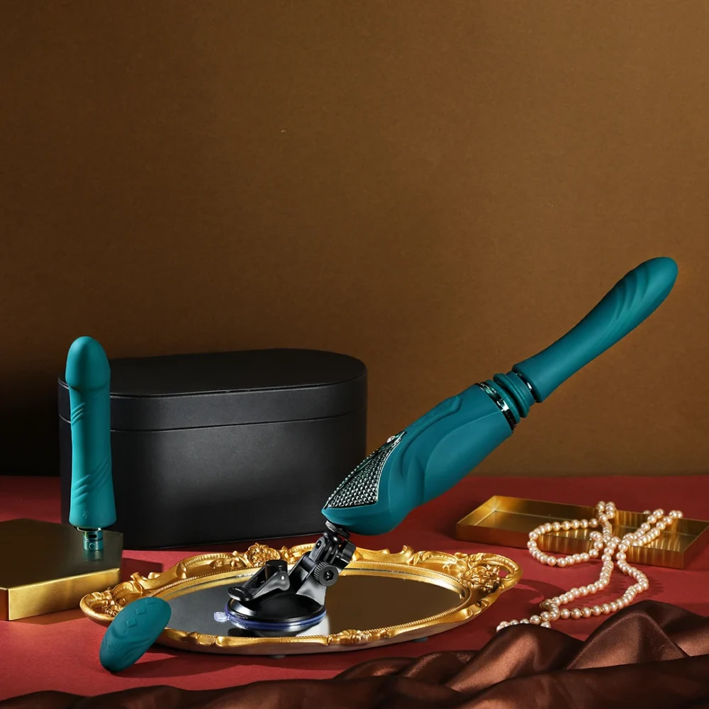 ZALO® Sesh Compact Sex Machine equipped with two replaceable vibrating massage sticks in Turqoise Green color.